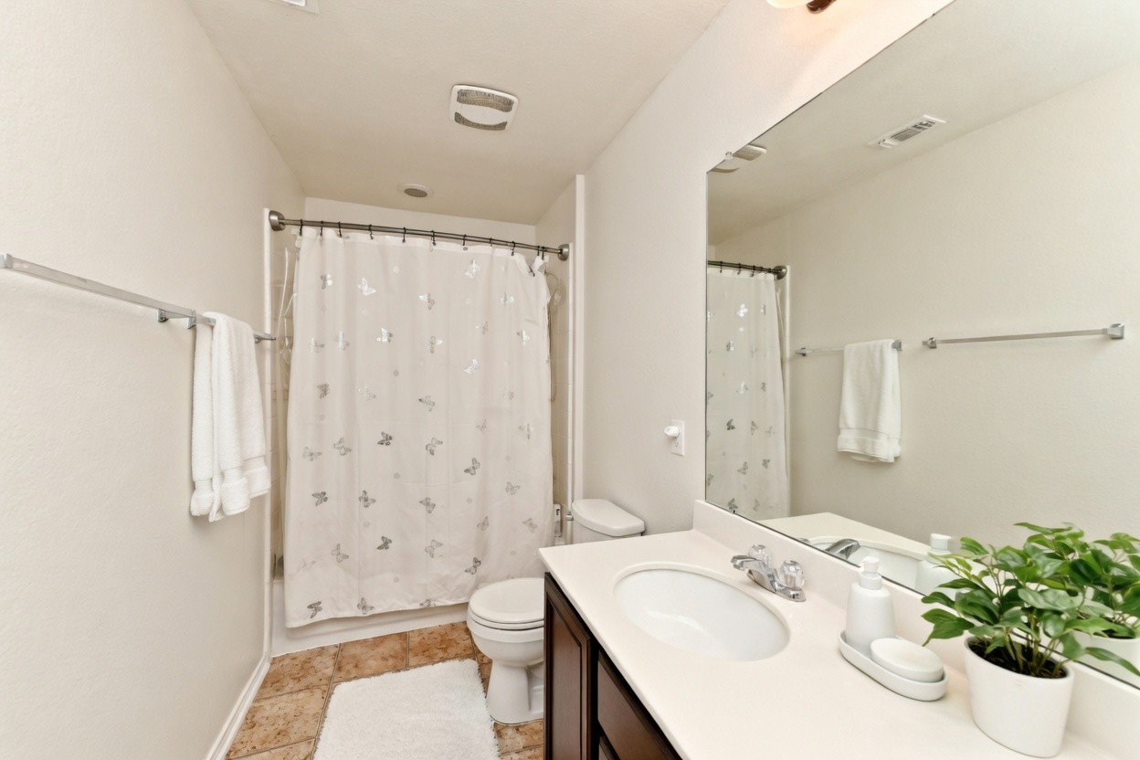 210 Animas Drive Georgetown, TX 78626 - Photo 24 of 31 a bathroom with a sink toilet and shower
