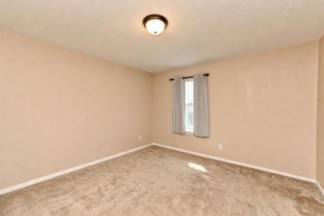 210 Animas Drive Georgetown, TX 78626 - Photo 26 of 31 an empty room with a empty space and a window