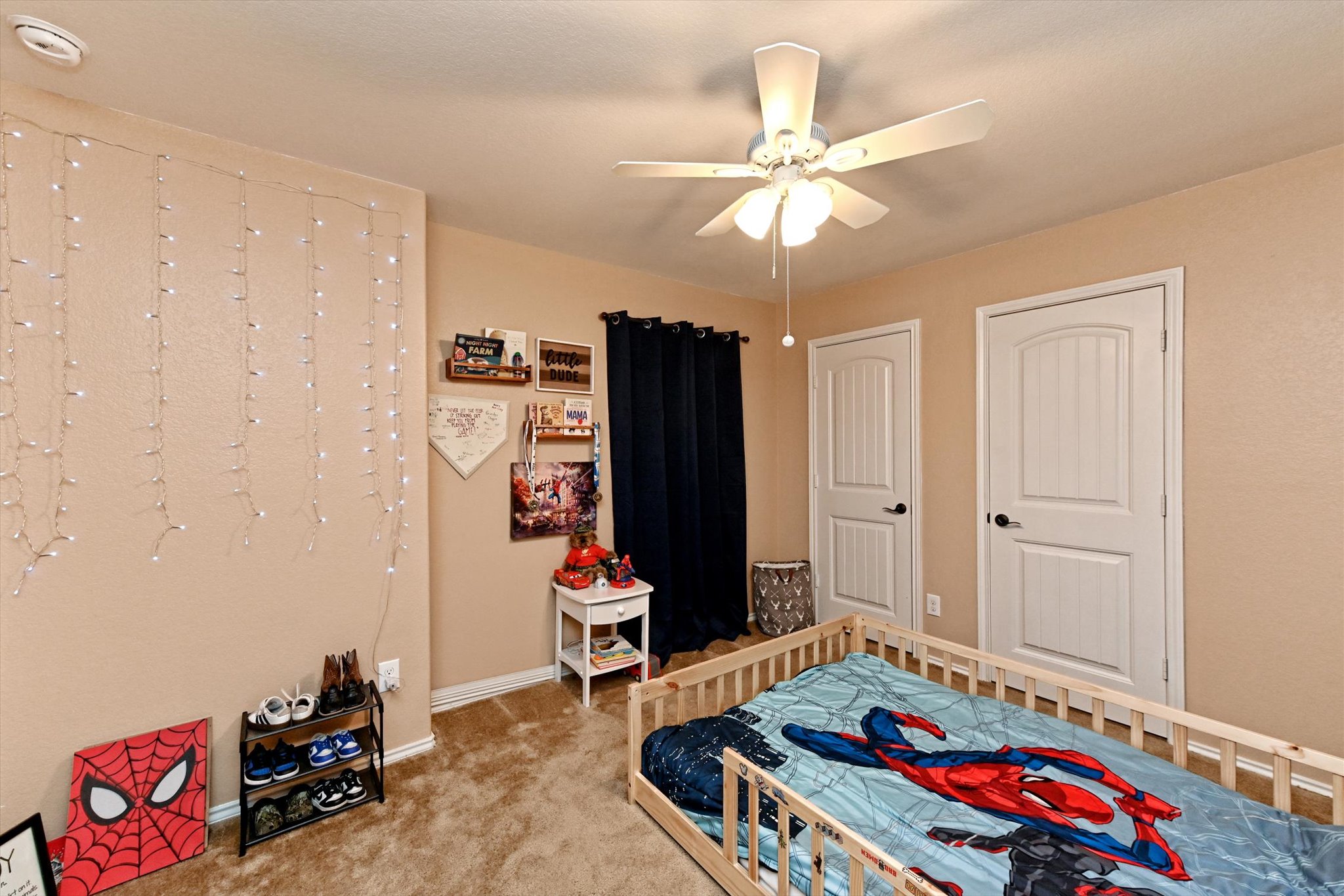 210 Animas Drive Georgetown, TX 78626 - Photo 28 of 31 a bedroom with a bed and a chandelier