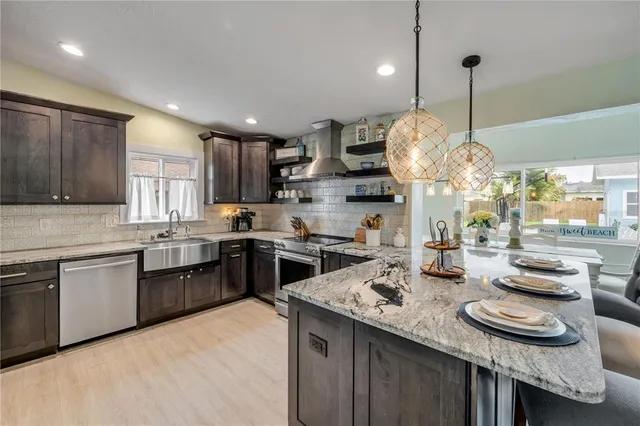 a living room with furniture a fireplace a flat screen tv and a window
