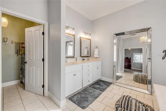 a view of swimming pool with outdoor seating and a garden