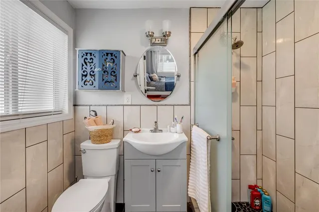 a front view of a building with a garden