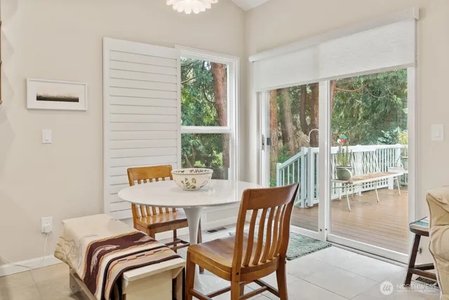 a view of a dining room with furniture window and outside view