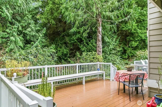 a view of a chair and table on the deck