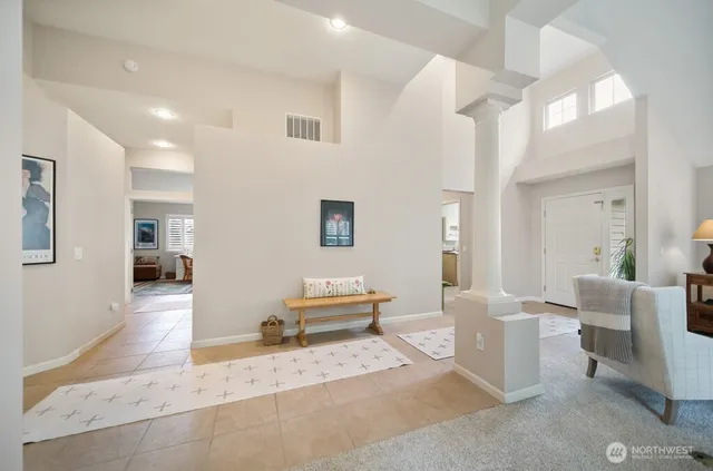 a living room with furniture and a table