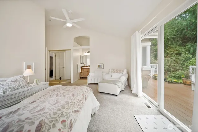 a bedroom with a bed and a chair