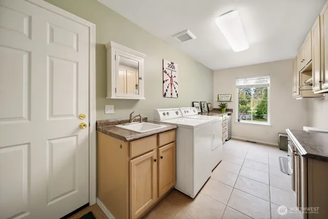 a view of a house with a yard and sitting area