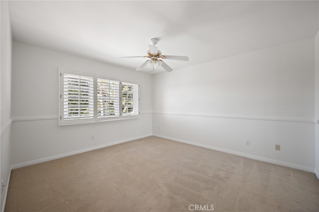 16 Charmony Laguna Niguel, CA 92677 - Photo 21 of 37 an empty room with windows and chandelier fan
