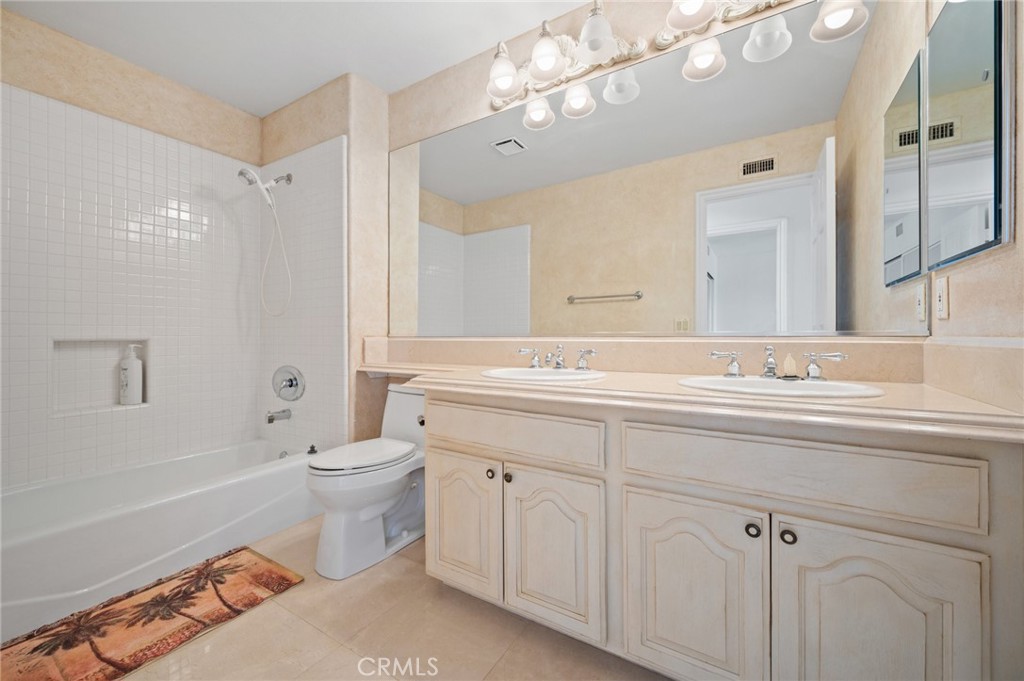 16 Charmony Laguna Niguel, CA 92677 - Photo 22 of 37 a bathroom with a toilet a sink a mirror a bathtub and shower