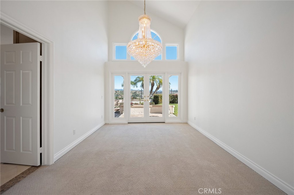 16 Charmony Laguna Niguel, CA 92677 - Photo 29 of 37 a view of a room with a chandelier fan and windows