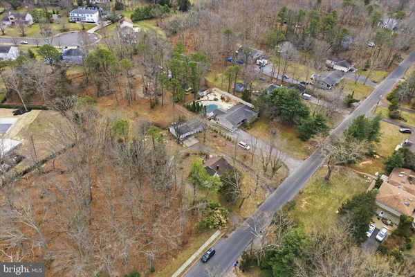 a aerial view of a house with a yard