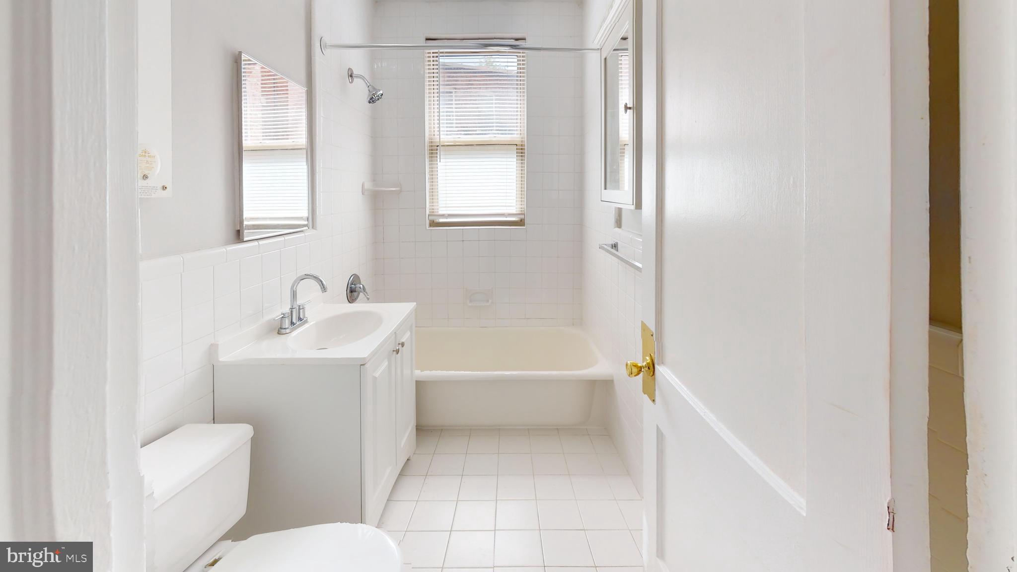 3446 Connecticut Avenue Northwest, Unit 203 Washington, DC 20008 - Photo 11 of 11 a bathroom with a sink toilet and shower