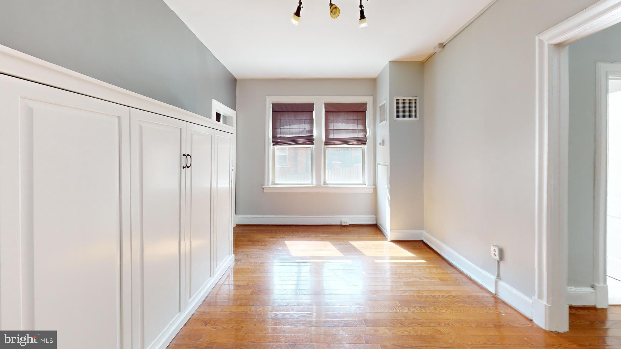 3446 Connecticut Avenue Northwest, Unit 203 Washington, DC 20008 - Photo 6 of 11 a view of a hallway with wooden floor and closet