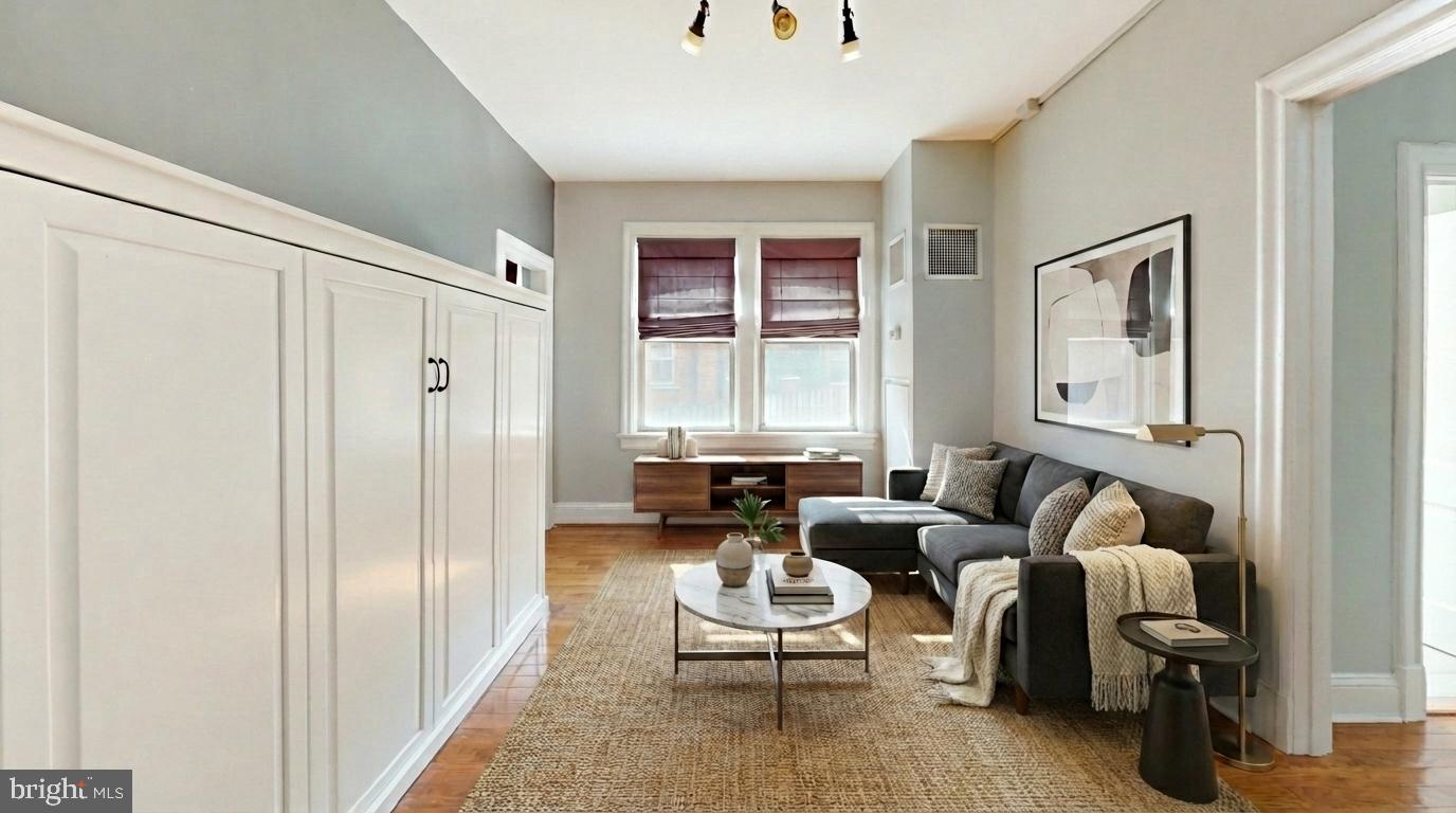 3446 Connecticut Avenue Northwest, Unit 203 Washington, DC 20008 - Photo 7 of 11 a living room with furniture and a window