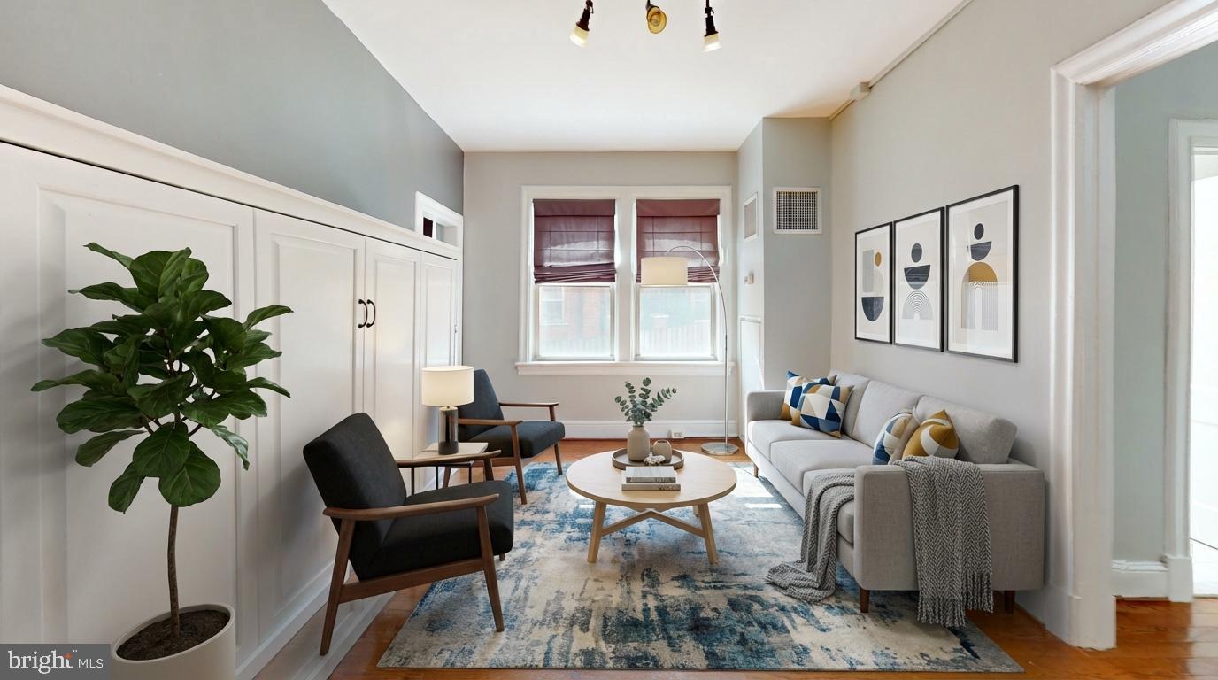 3446 Connecticut Avenue Northwest, Unit 203 Washington, DC 20008 - Photo 8 of 11 a living room with furniture potted plant and a window