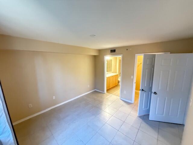 6768 Heritage Grande, Unit 7206 Boynton Beach, FL 33437 - Photo 6 of 9 an empty room with a bathroom