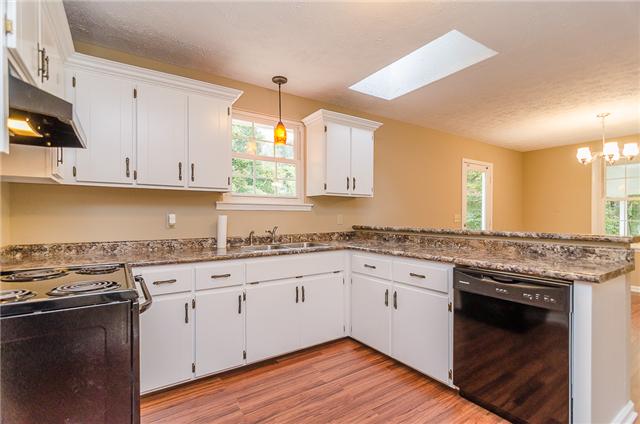 1017 Winding Ridge Road Goodlettsville, TN 37072 - Photo 4 of 10 Kitchen with new countertops,appliances, pendant light, and bar!