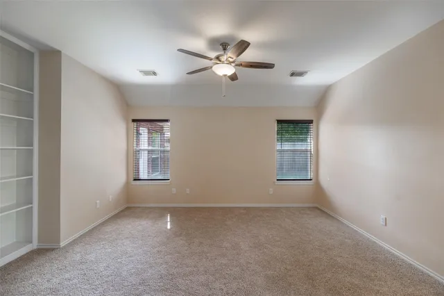 a view of a chandelier fan in a room