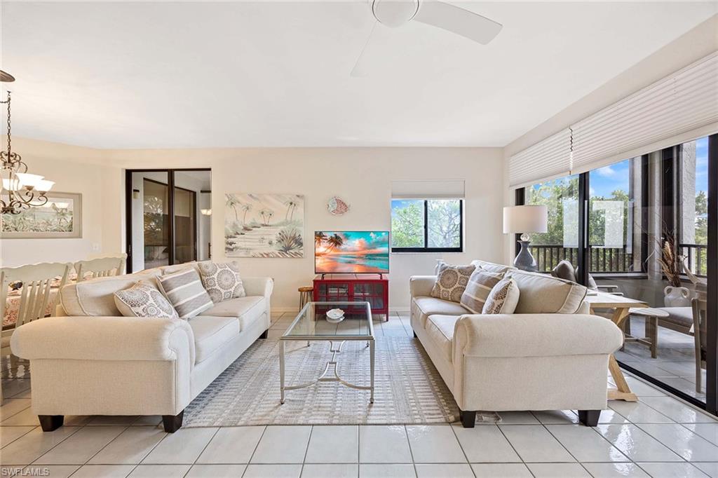 6500 Valen Way, Unit A402 Naples, FL 34108 - Photo 12 of 49 a living room with furniture and a large window