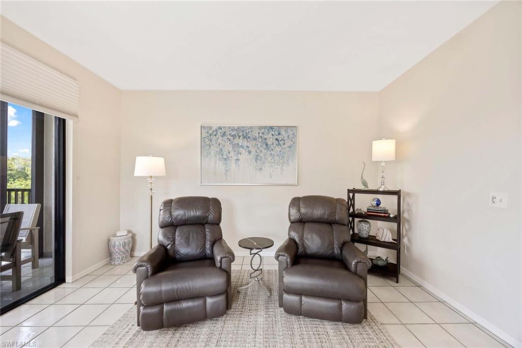 6500 Valen Way, Unit A402 Naples, FL 34108 - Photo 13 of 49 a living room with furniture