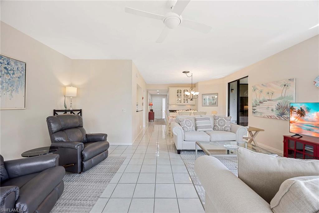 6500 Valen Way, Unit A402 Naples, FL 34108 - Photo 14 of 49 a living room with furniture