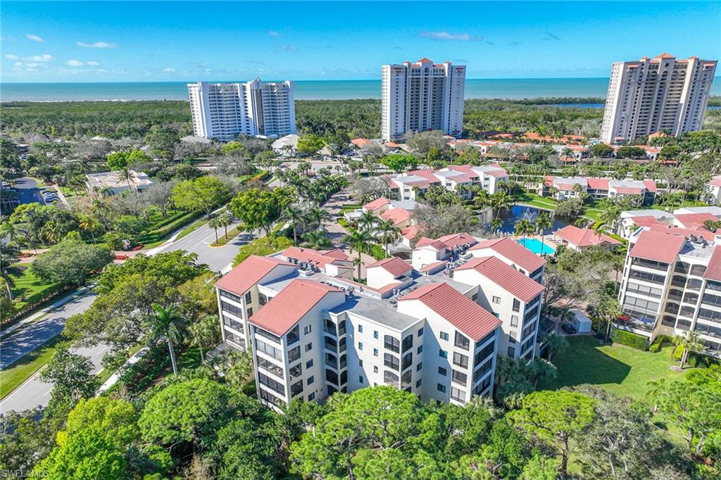 6500 Valen Way, Unit A402 Naples, FL 34108 - Photo 2 of 49 a view of a city and garden