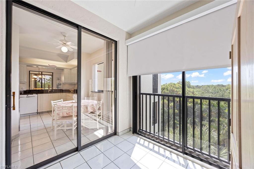 6500 Valen Way, Unit A402 Naples, FL 34108 - Photo 26 of 49 a bathroom with a glass shower door and mirror