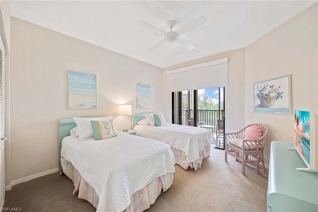 6500 Valen Way, Unit A402 Naples, FL 34108 - Photo 27 of 49 a bedroom with a bed and a window