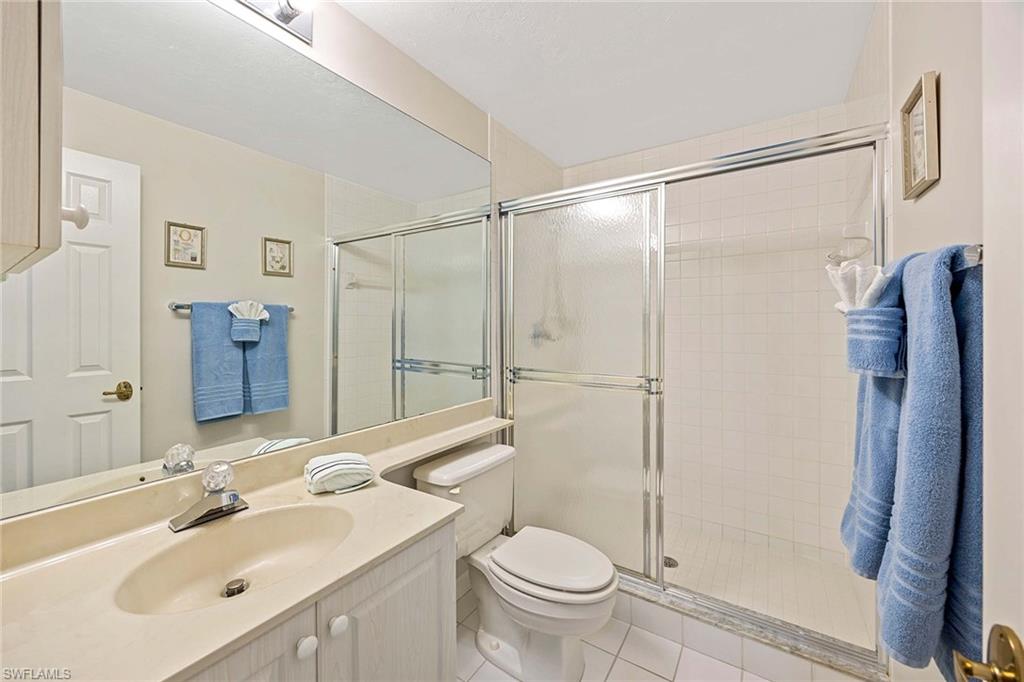 6500 Valen Way, Unit A402 Naples, FL 34108 - Photo 30 of 49 a bathroom with a sink toilet and shower