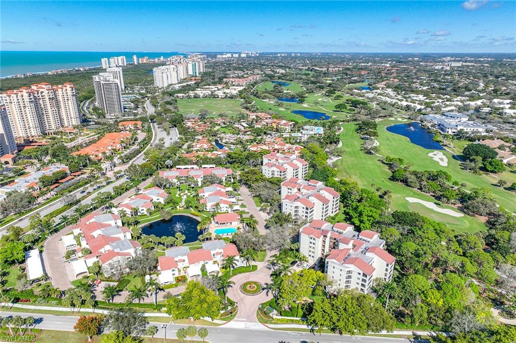 6500 Valen Way, Unit A402 Naples, FL 34108 - Photo 3 of 49 an aerial view of residential houses with outdoor space