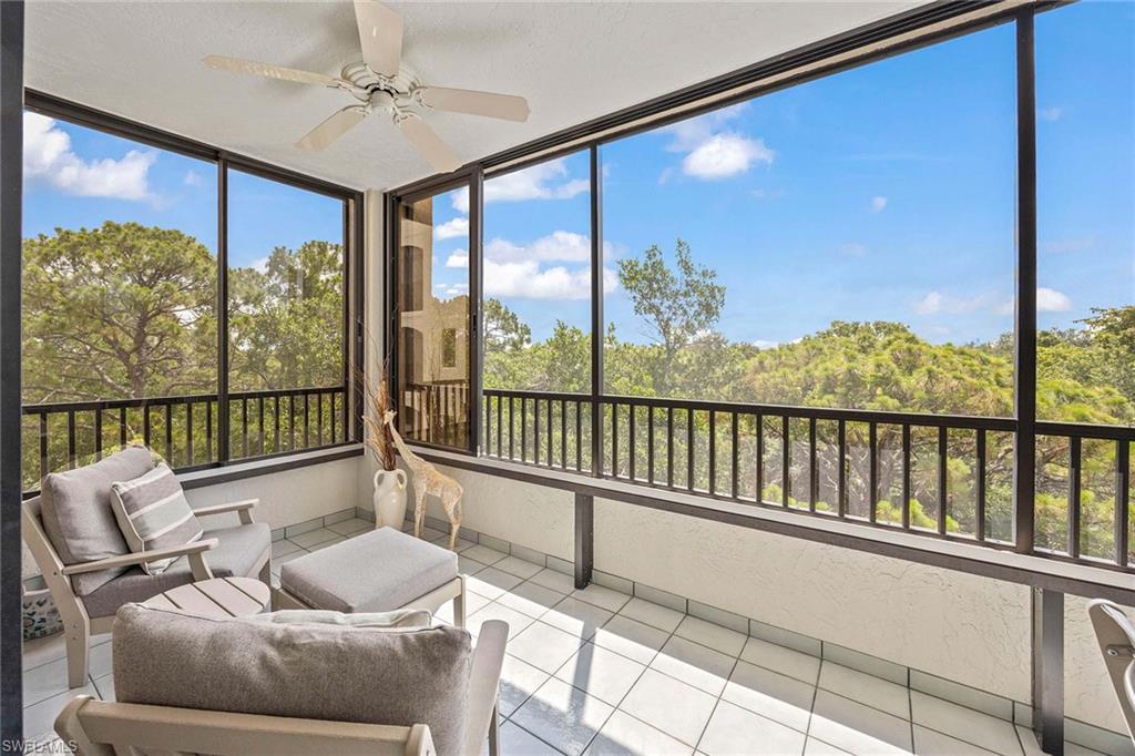 6500 Valen Way, Unit A402 Naples, FL 34108 - Photo 32 of 49 a balcony with furniture and a potted plant