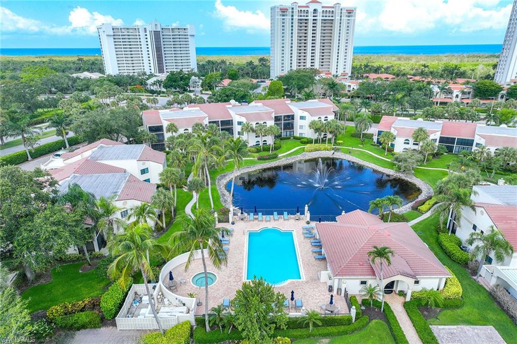 6500 Valen Way, Unit A402 Naples, FL 34108 - Photo 35 of 49 an aerial view of multiple houses with yard