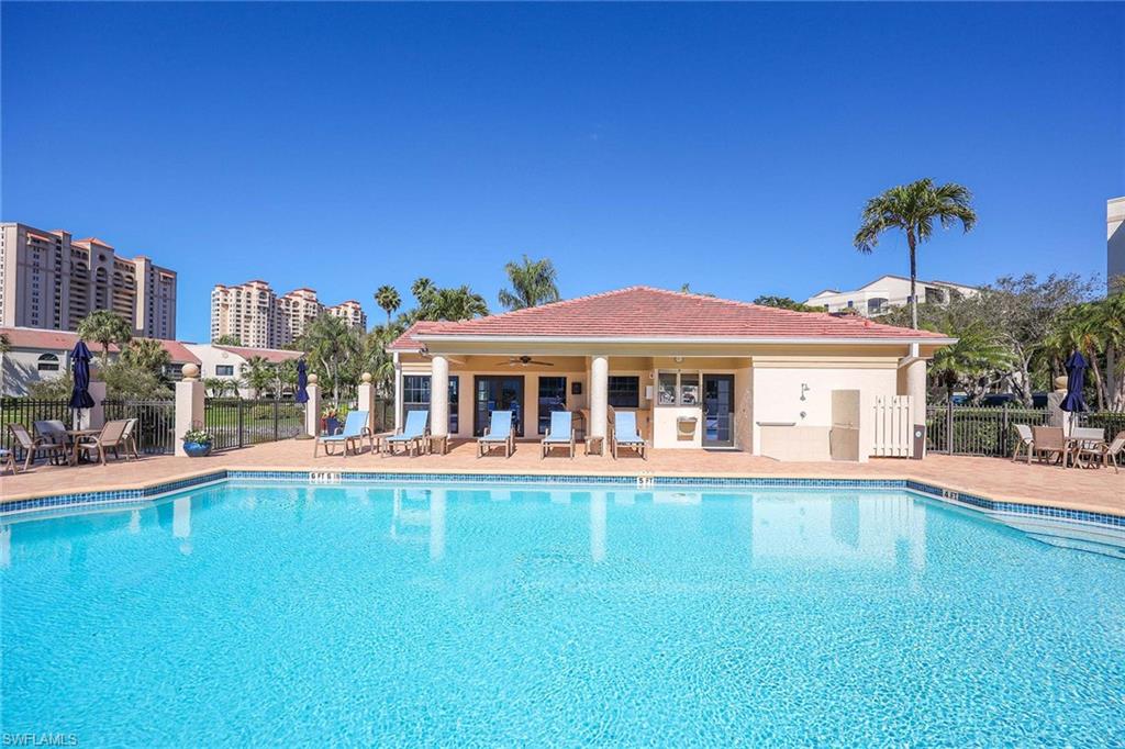 6500 Valen Way, Unit A402 Naples, FL 34108 - Photo 39 of 49 a view of a house with a swimming pool