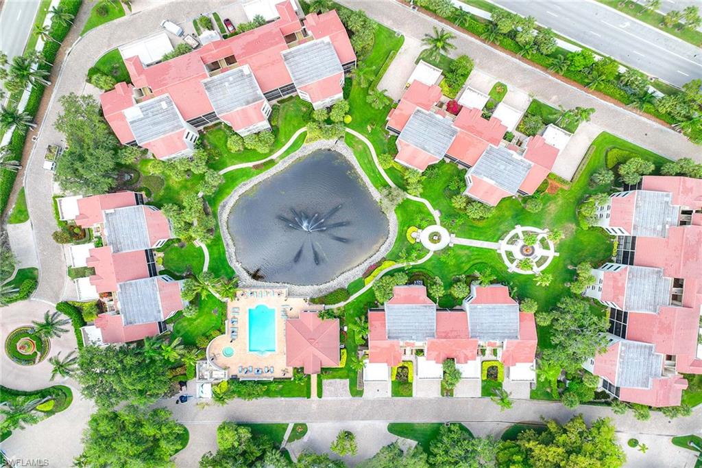 6500 Valen Way, Unit A402 Naples, FL 34108 - Photo 42 of 49 an aerial view of a house with a swimming pool