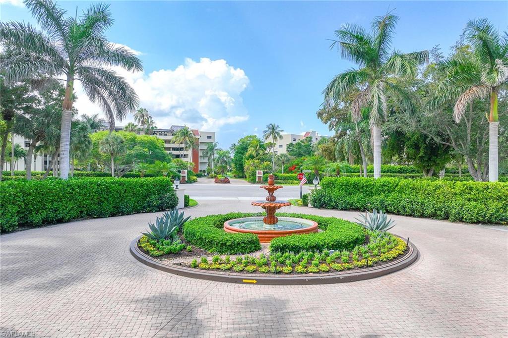 6500 Valen Way, Unit A402 Naples, FL 34108 - Photo 48 of 49 a view of a garden with a fountain