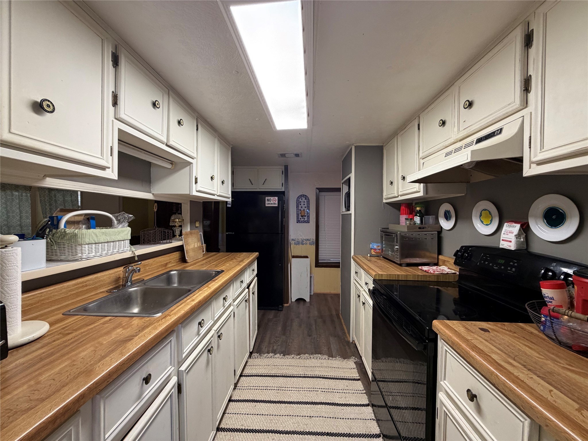 161 East Waltz Lane Trinity, TX 75862 - Photo 20 of 39 a kitchen with stainless steel appliances granite countertop a stove a sink and a refrigerator