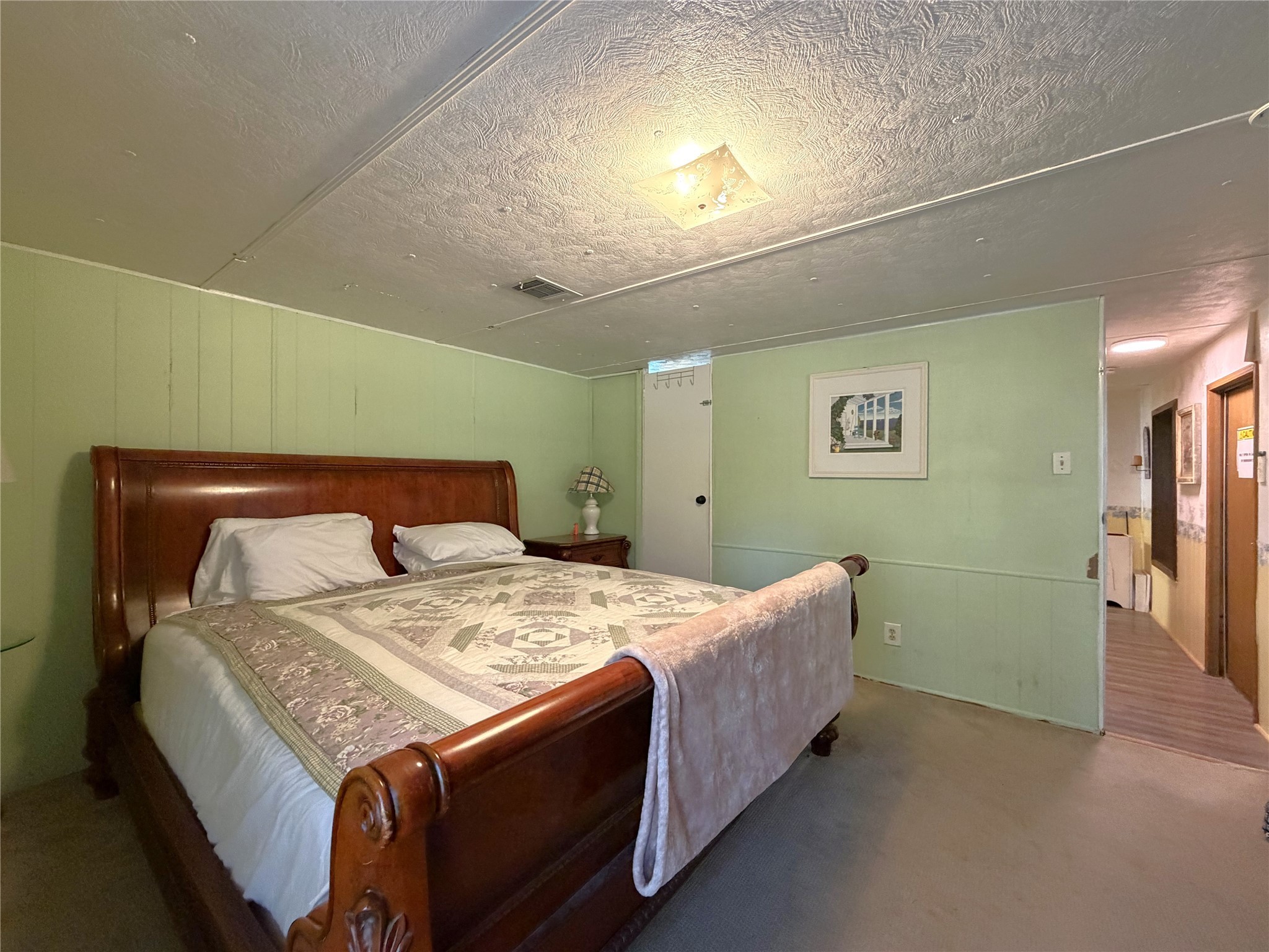 161 East Waltz Lane Trinity, TX 75862 - Photo 24 of 39 a bedroom with a bed and a potted plant