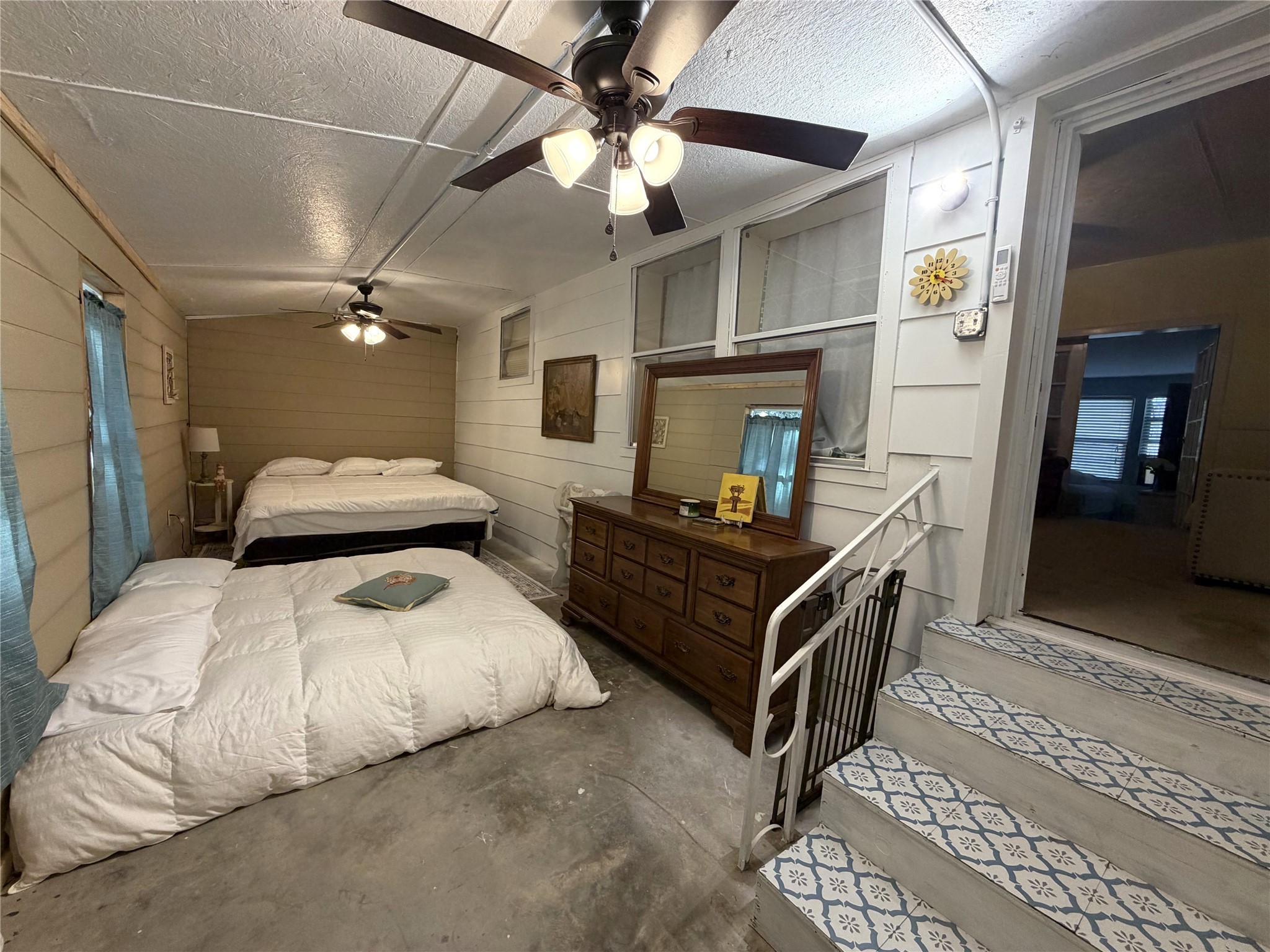 161 East Waltz Lane Trinity, TX 75862 - Photo 34 of 39 a bedroom with double bed and a chandelier