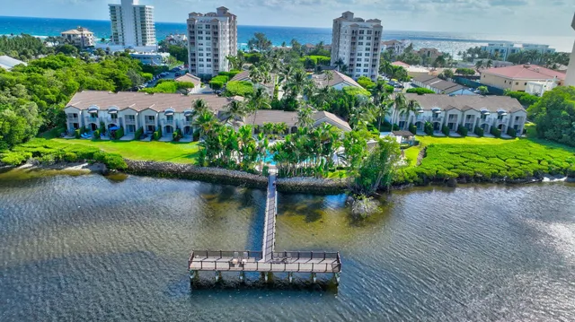 a view of swimming pool with outdoor seating and plants