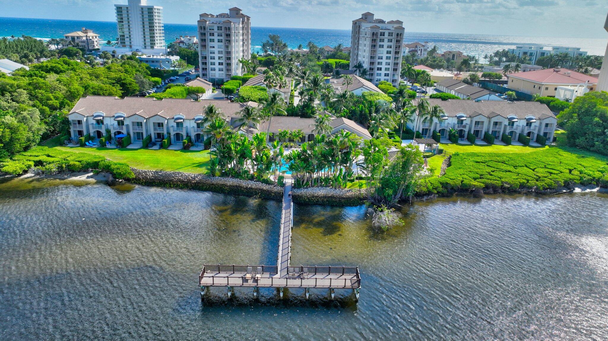 3606 South Ocean Boulevard, Unit 406 Highland Beach, FL 33487 - Photo 6 of 30 a view of a house with a yard and a pond