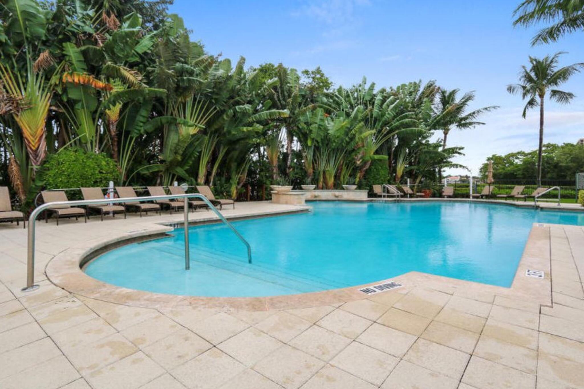 3606 South Ocean Boulevard, Unit 406 Highland Beach, FL 33487 - Photo 9 of 30 a view of swimming pool with outdoor seating and plants