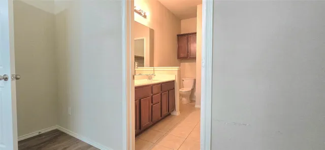 a view of a bathroom from a hallway