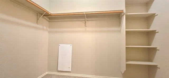 a view of a room with rack on the wall