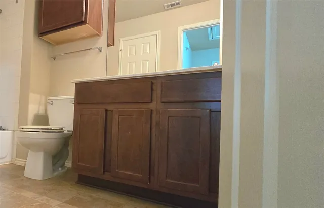 a bathroom with a toilet and a sink