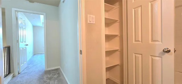 a view of a bathroom from a hallway