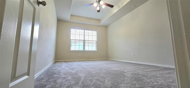 a view of an empty room with a window