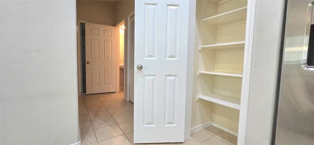 a view of an entryway with front door