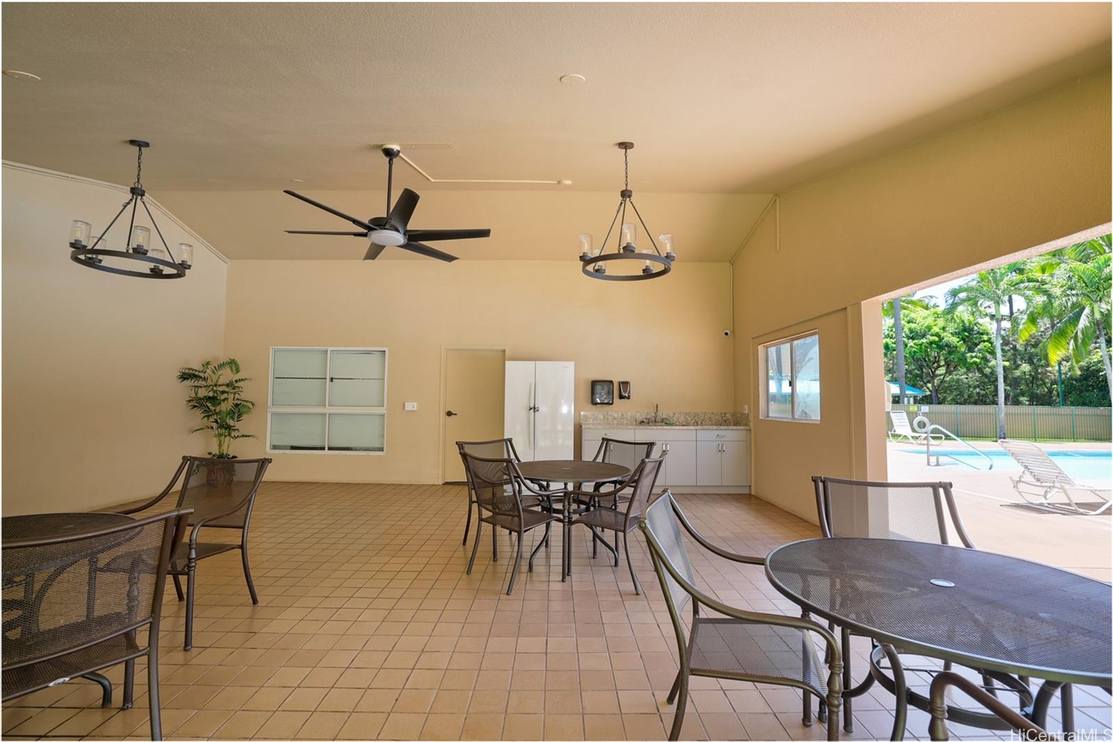 3009 Ala Makahala Place, Unit 1804 Honolulu, HI 96818 - Photo 18 of 20 a view of a dining room with furniture window and outside view