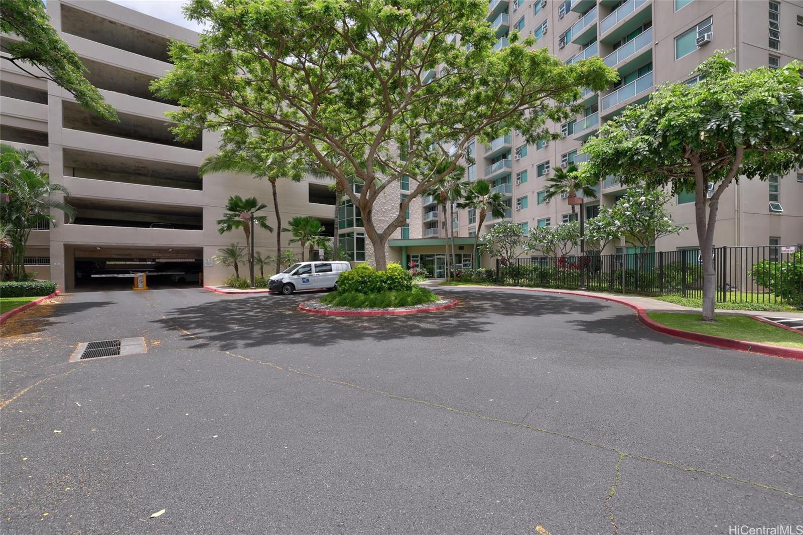 3009 Ala Makahala Place, Unit 1804 Honolulu, HI 96818 - Photo 19 of 20 a view of street with large trees