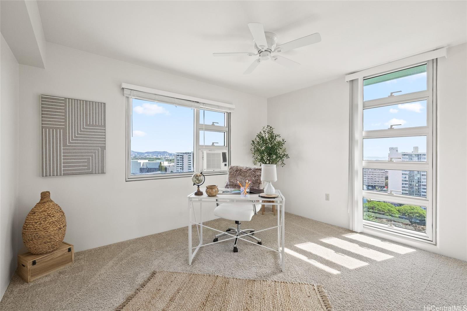 3009 Ala Makahala Place, Unit 1804 Honolulu, HI 96818 - Photo 9 of 20 a living room with furniture and a window